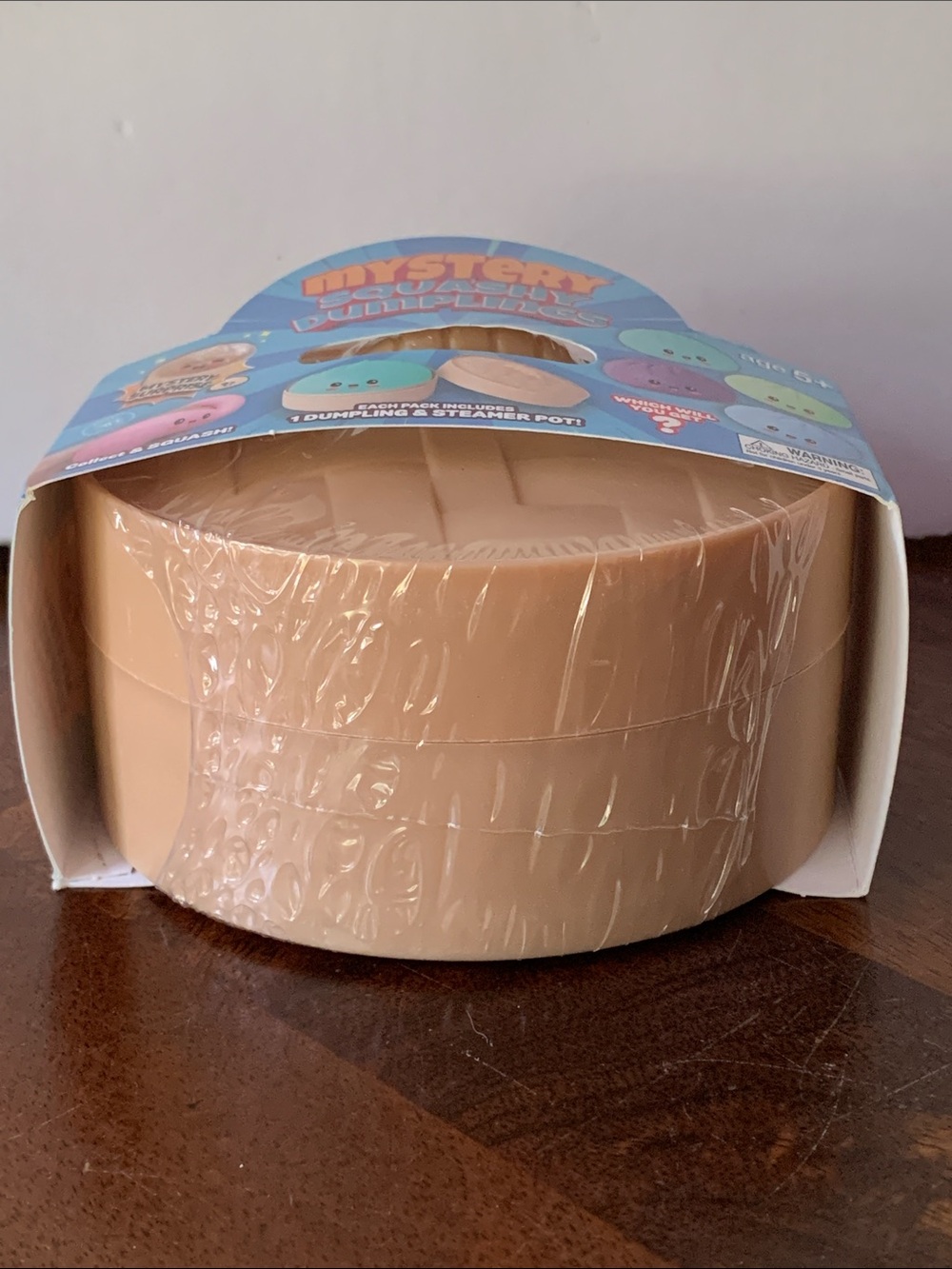 Mystery Squashy Dumplings Kids Toy - Tan Steamer Pot with Blue Packaging - Picture 3 of 4